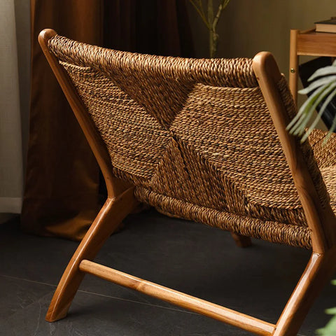 Rattan lounge chair with solid wood backrest