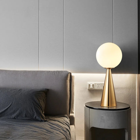 The Cone table lamp, modern cone lamp with a frosted glass sphere in gold or black