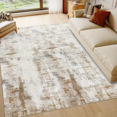 Beige abstract washable rug on a wooden floor in a living room