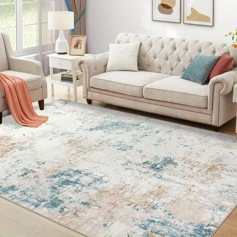 Beige abstract washable rug with a cream sofa