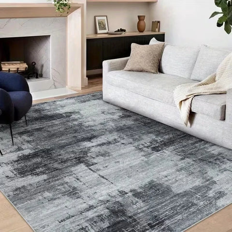 Dark grey abstract washable rug in a living room