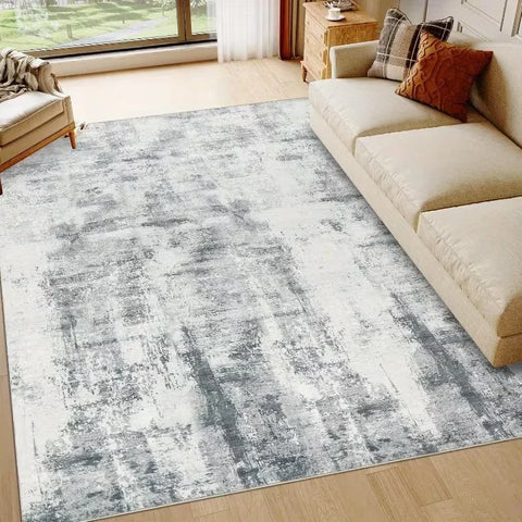 Grey and blue abstract washable rug in a living room