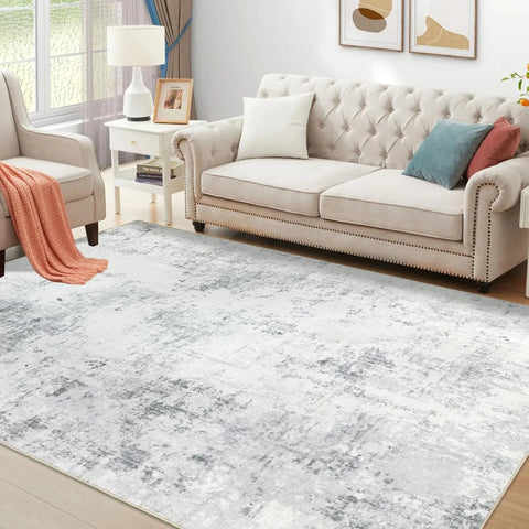 Light grey abstract washable rug in a bright living room