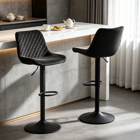 Two black velvet adjustable swivel bar stools at a breakfast bar
