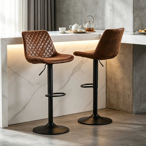 Two brown suede adjustable swivel bar stools at a breakfast bar