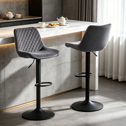 Two grey velvet adjustable swivel bar stools at a breakfast bar