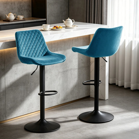 Two teal velvet adjustable swivel bar stools at a breakfast bar