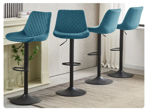 Teal velvet swivel bar stools shown at two seat heights