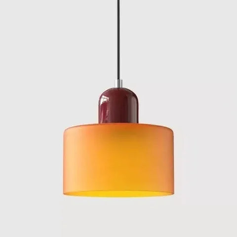 Amber glass pendant light with an oxblood cap