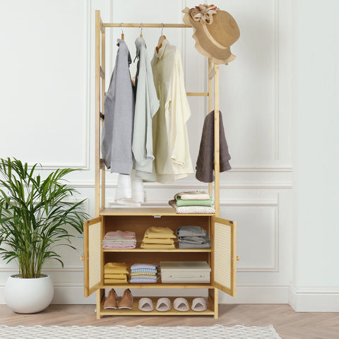 Bamboo clothes stand with open shelves and hanging clothes