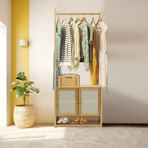 Bamboo clothes stand with cabinet against a yellow wall