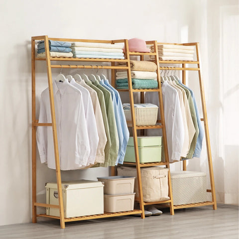 Bamboo ladder garment rack shown from the front with clothes