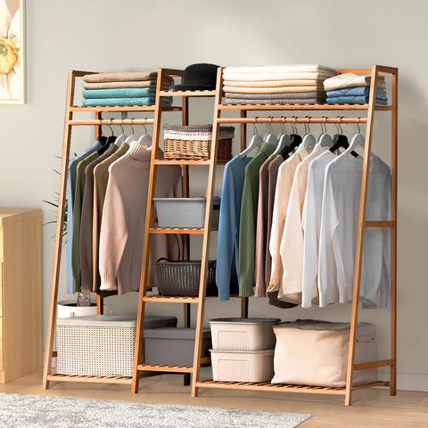 Bamboo ladder garment rack with shelves and hanging clothes