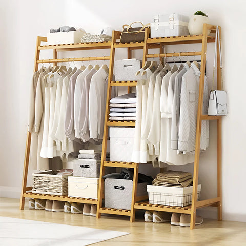 Bamboo ladder garment rack with a hanging rail and storage boxes