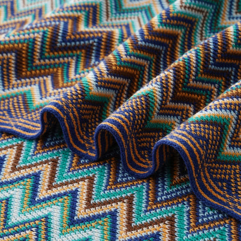 Close-up of the blue chevron knit in soft folds