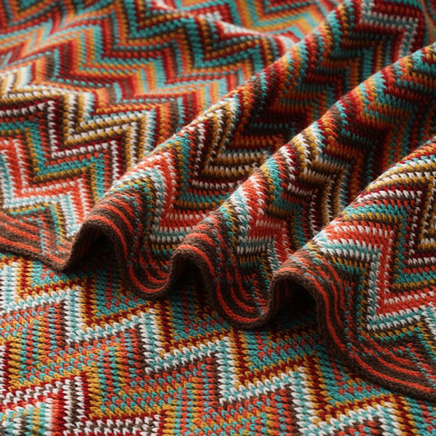 Close-up of the dusty red chevron knit in soft folds