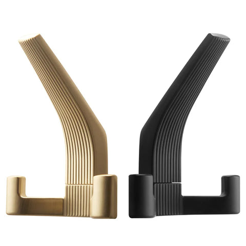Brushed brass and black wall hooks side by side