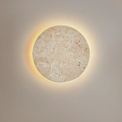 Cave stone wall light backlit against a plain wall