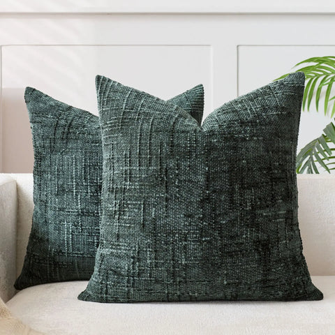 Dark green chenille cushion cover on a sofa