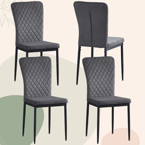 Four grey velvet dining chairs with black legs