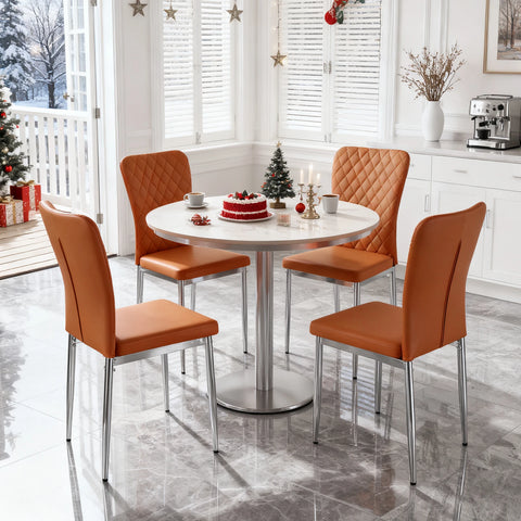 Orange chrome leg dining chairs around a round dining table