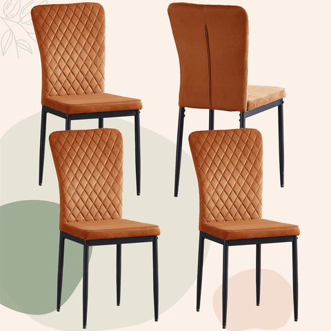 Four orange velvet dining chairs with black legs