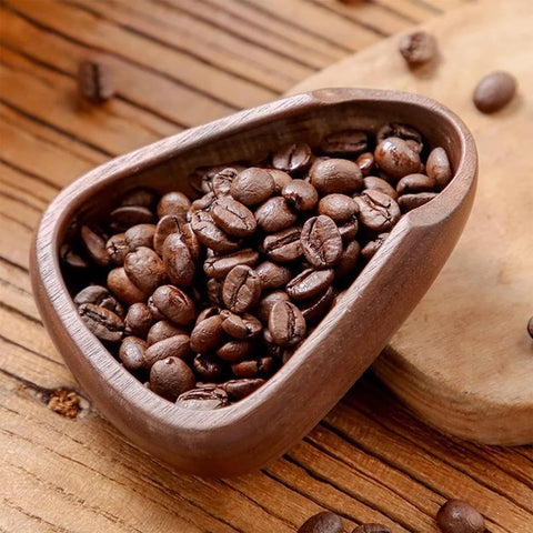 Wooden coffee scoop tray filled with coffee beans