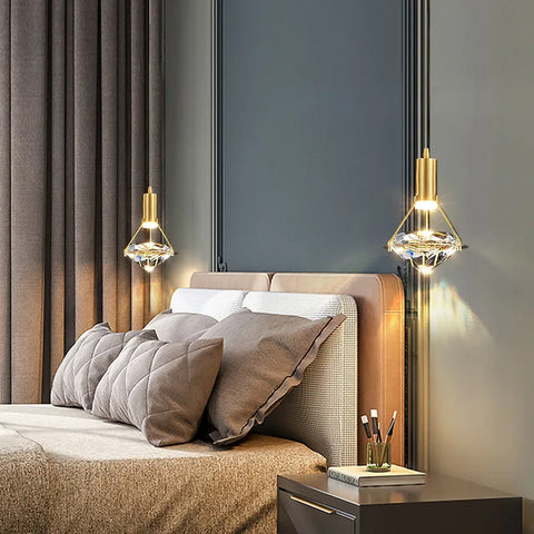 Pair of copper and crystal pendant lights in a bedroom