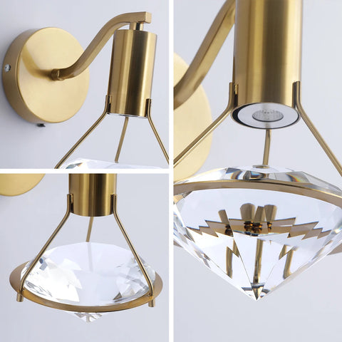 Copper and crystal wall light, close view of the brass arm and crystal shade