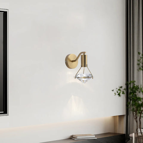 Copper and crystal wall light on a plain wall