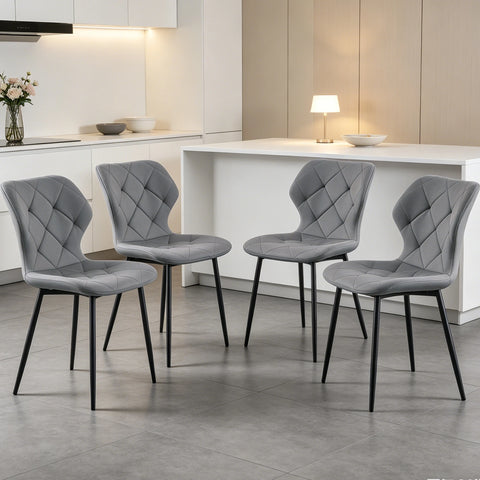 Set of four grey curved back dining chairs at a kitchen counter