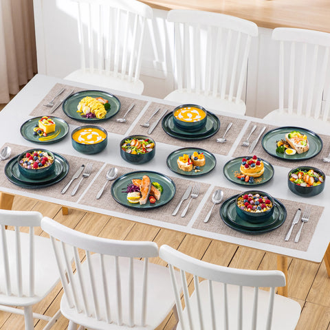 Curved edge green bowls filled with food on a table