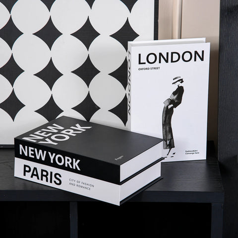 Decorative book boxes on a chequered floor