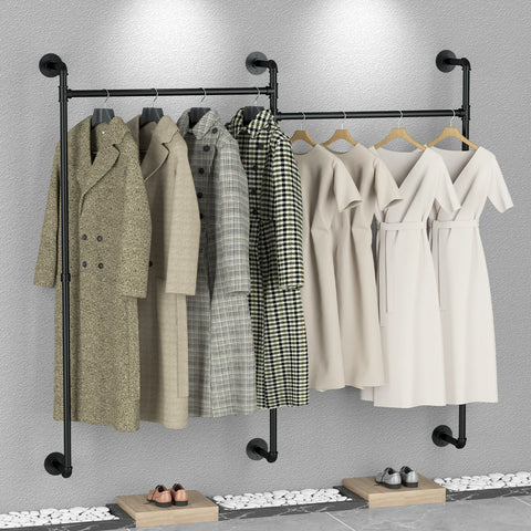 Black iron pipe clothes rail mounted on a wall, hung with coats and jackets