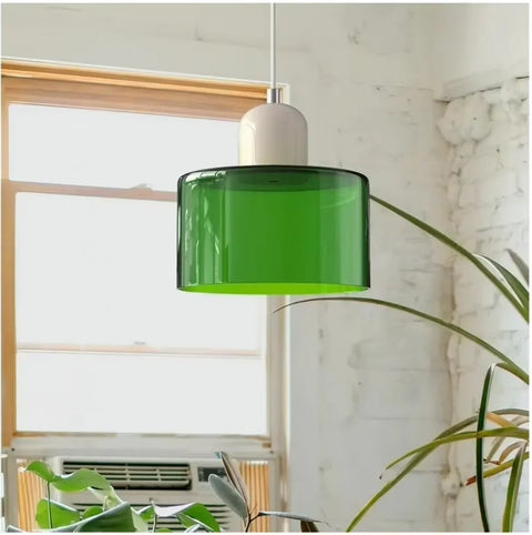 Emerald green glass pendant light by a window