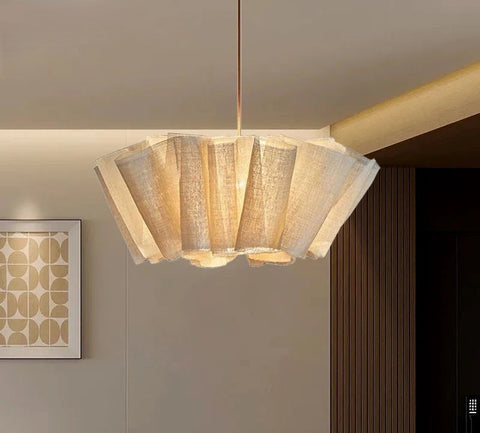 Pleated fabric chandelier in a room with a framed picture
