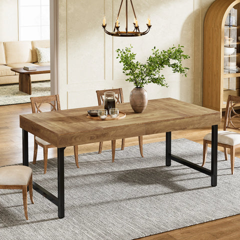 Rustic brown farmhouse dining table with black metal legs in a bright dining room