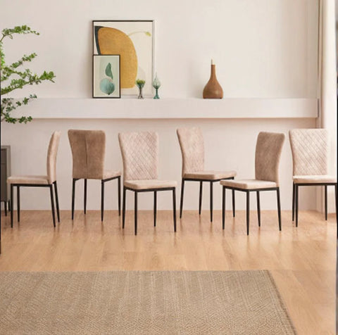 Six beige faux suede dining chairs in a dining room