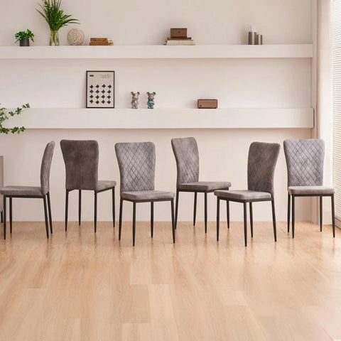 Six grey faux suede dining chairs along a wall