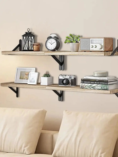 Floating wooden shelf holding a clock and picture frames