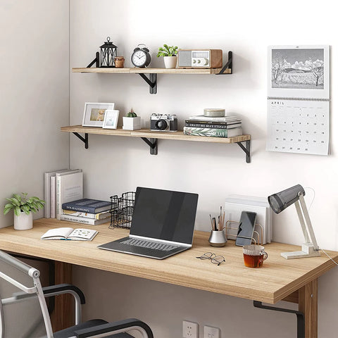Floating wooden shelves mounted above a desk