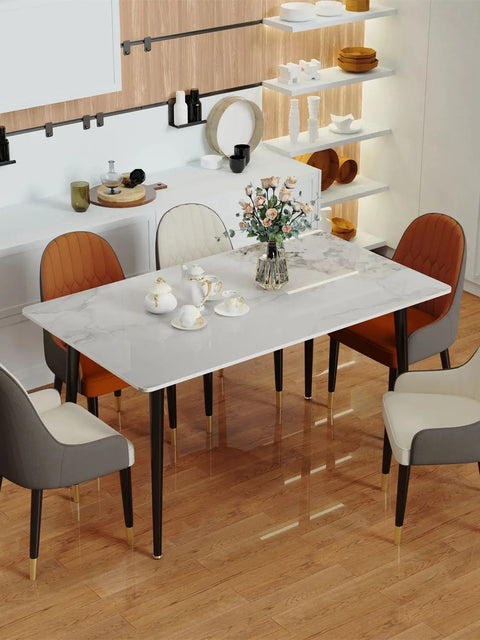Gloss marble dining table set for a meal with six chairs