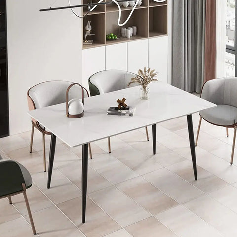 Glossy white marble dining table with tapered black legs