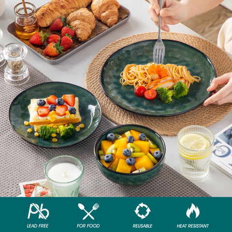 Green stoneware plate served with food, with material and safety icons