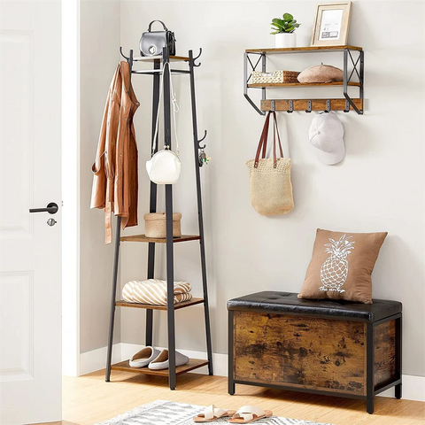 Black iron coat stand with shelves and a storage bench