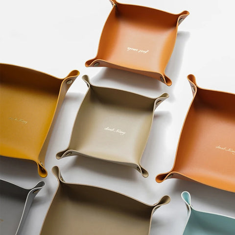 Stack of tan leather valet trays