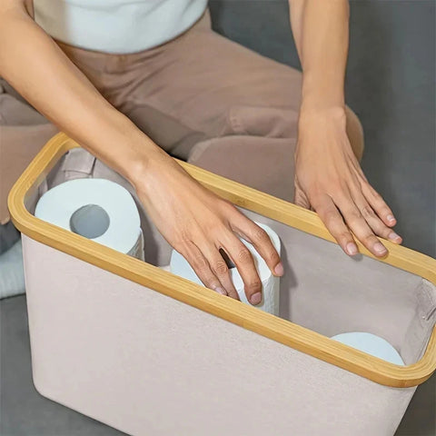 Lifting the bamboo lid off a lidded storage basket