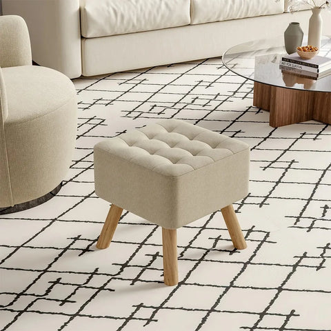 Beige linen footstool in a bright living room