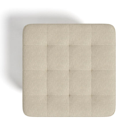 Overhead view of the quilted linen footstool seat