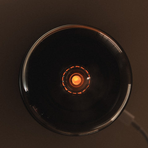 Top view of the black Mistt diffuser showing the lit mist outlet ring